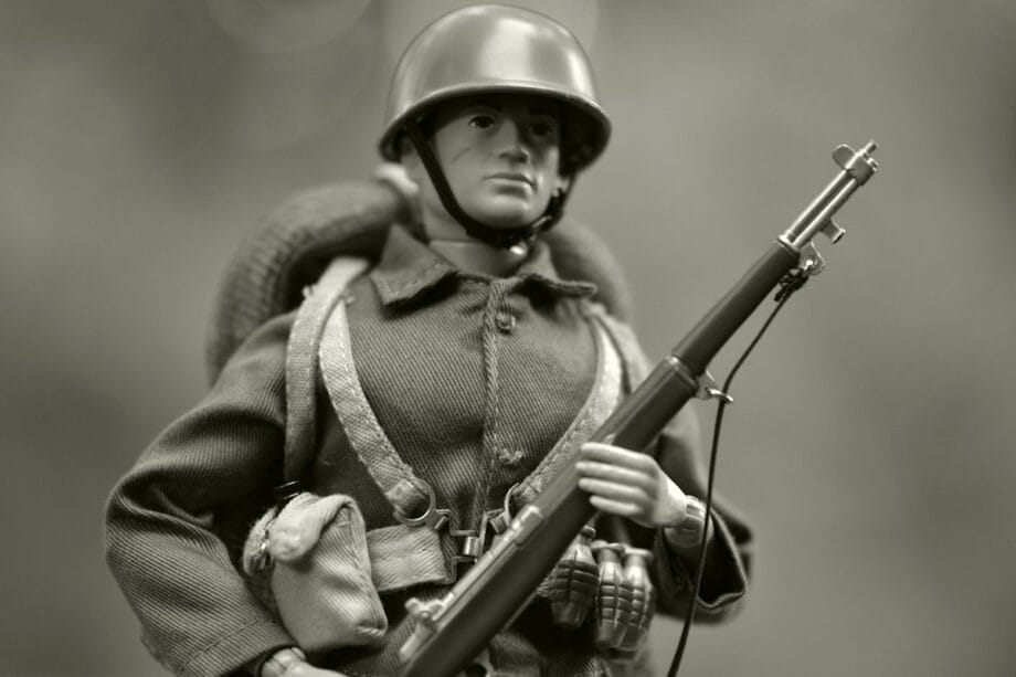 A black and white photo of a toy soldier
