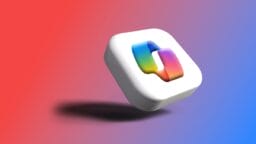 A white 3D square with a multicolored, linked chain icon floats against a red to purple gradient background.