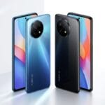 Four Redmi smartphones are displayed upright in blue and black colors, showing both the front screens and rear camera designs.