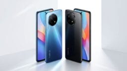 Four Redmi smartphones are displayed upright in blue and black colors, showing both the front screens and rear camera designs.