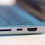 Close-up of a laptop’s side ports, including an SD card slot, USB-C port, and HDMI port.