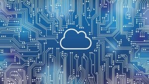 Illustration of a cloud icon at the center of a blue circuit board background representing cloud computing technology.
