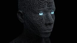 A digital rendering of a human head made of black wireframe mesh with glowing blue eyes on a dark background.