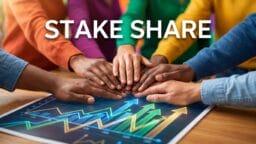 Several hands stacked together over a table with financial charts, with the words Stake Share displayed above.