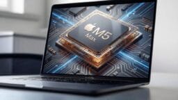 A laptop screen displays a digital graphic of an Apple M5 Max chip on a circuit board background.