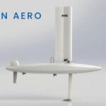 A white autonomous sail-powered marine drone with a vertical sail and rudder, labeled Ocean Aero on a plain background.