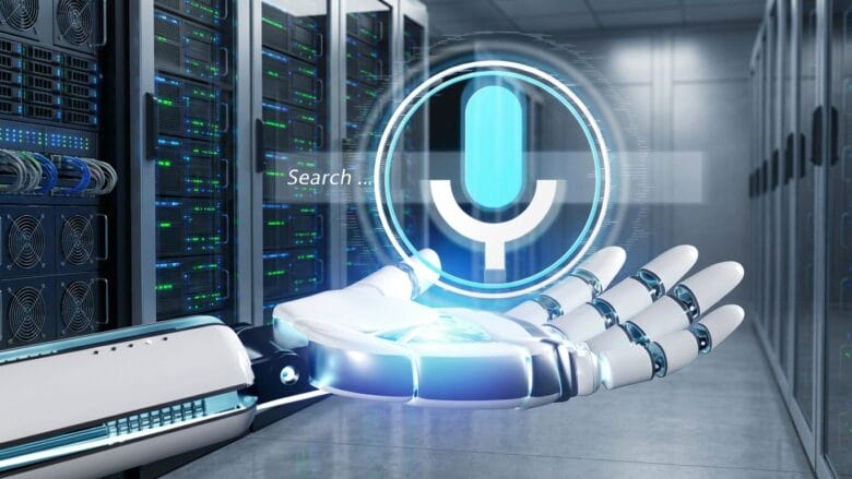 A robotic hand holds a digital voice search icon in a server room with rows of data servers in the background.