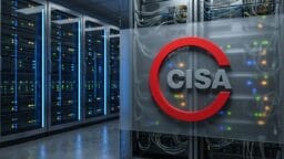 A glass wall with a red CISA logo in front of server racks in a data center.