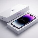 A new iPhone with a gradient screen is displayed inside an open white Apple box on a light background.