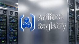 A metallic server rack labeled Artifact Registry with a blue logo, surrounded by other server racks and data center equipment.