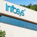 The Infosys logo is displayed on the upper corner of a modern office building with trees in the background.