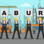 Five construction workers in hard hats hold signs spelling LABOUR MARKET at a building site with cranes and other workers in the background.