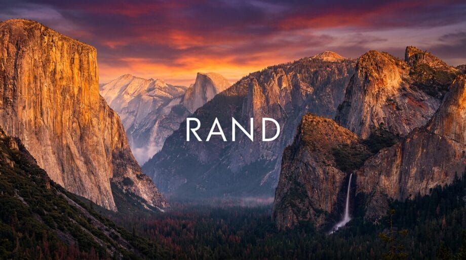 Sunset over Yosemite Valley with granite cliffs, forested slopes, a waterfall, and “RAND” text centered in the image.