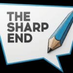 A speech bubble with the words The Sharp End next to an illustration of a sharpened blue pencil on a white background.