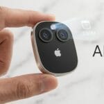 A hand holds a small, sleek device with two camera lenses and an Apple logo; a digital calendar projection appears above it with text AI PIN.