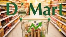 A shopping cart with coins and an upward arrow in a supermarket aisle under a large DMart sign.