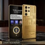 Two gold-colored smartphones labeled Trump, one displaying apps and a seal, the other showing engraved designs and text, on a desk.